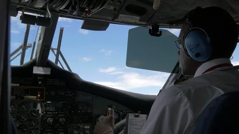 Co-pilot talking to the pilot inside the cockpit Stock Footage 87511076