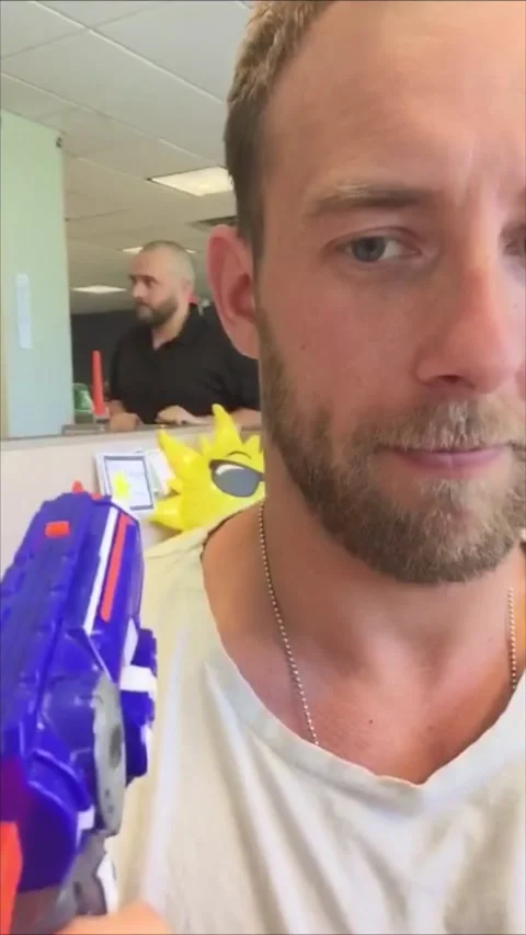 Co-Worker Cops Endless Barrage of Nerf Bullets, Grand Rapids, Michigan, USA - 26 Stock Footage 205327443