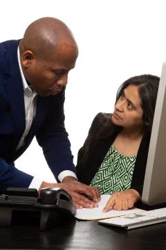Co-Worker Explaining Something to Confused Team Mate Stock Photos