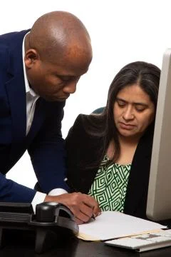 Co-Worker Explaining Something to Team Mate 스톡 사진