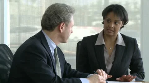 Co-workers discuss presentation (1 of 7) Stock Footage 10743628