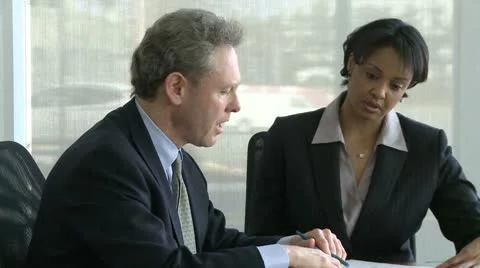 Co-workers discuss presentation (2 of 7) Stock Footage 10743636