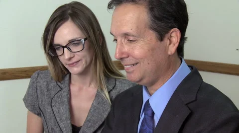 Co-Workers Discussing Business Stock Footage 40704590