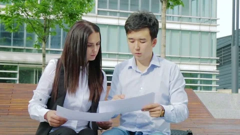 Co-workers discussing a project and meeting an agreement Video stock 76649561