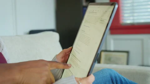 Co-worker's hands and reviewing and discussing content found on a Tablet. Stock-Footage 209160982