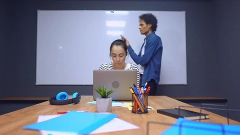 Co-workers solving big problem with data report Stock Footage 112075279