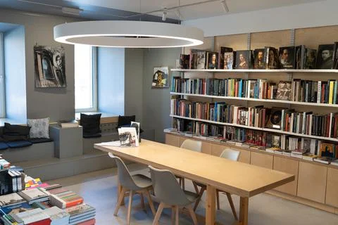 Co working space in library with a lot of books and modern interior Stock Photos
