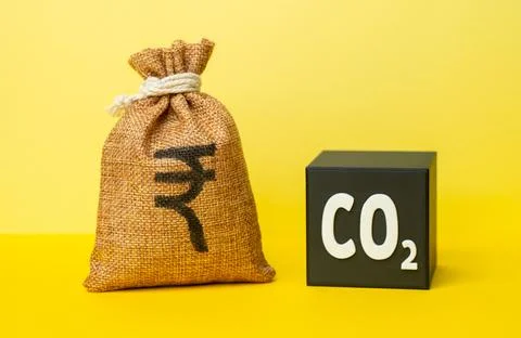 A CO2 cube and a indian rupee money bag. Waste recycling and profit generatio Stock Photos