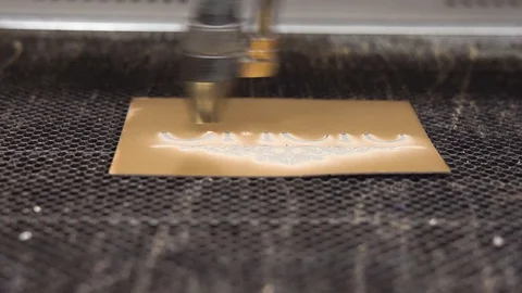 CO2 Laser Engraving Machine fast moving head on a metal plate Stock Footage 101258417