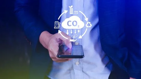 CO2 reducing icon using smartphone for decrease CO2, carbon footprint and c.. Stock Photos
