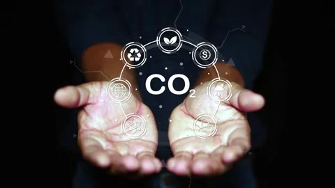 CO2 Reduction: Hands Present Conceptual Hologram on Black Background  Stock Footage 259571995