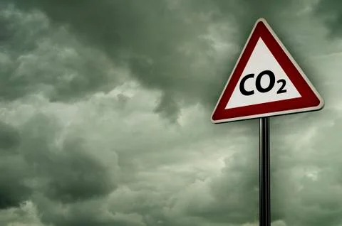 Co2 on roadsign under dark cloudy sky Stock Photos