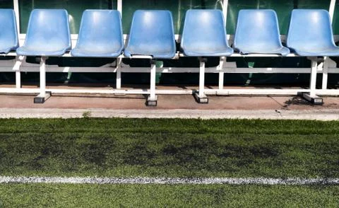 Coach and reserve benches in a soccer field Stock Photos