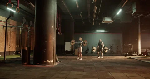 Coach and student training with weights in gym Stock Footage 272372840