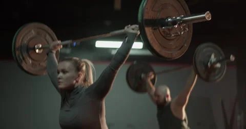 Coach and trainee training with barbell in gym Stock Footage 272372235