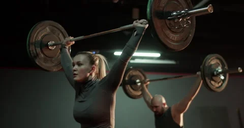 Coach and trainee training with barbell in gym Video stock 272376788