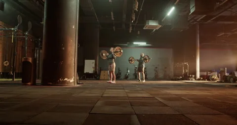 Coach and trainee training in lifting weights Stock Footage 272373130