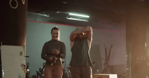Coach and trainee walking in gym Video stock 272367906