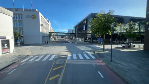 Coach, bus front window view driving on road Fv44 in Sandnes centre. 動画素材 314045817