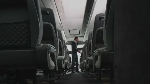 Coach Bus Operator Checking Aisle Seats And Storage Compartments After Video stock 131660059