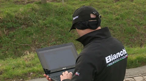 Coach checking data on laptop Stock Footage 37080043