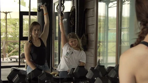 Coach with a child doing exercises in the gym. 10.08.2017. Kyiv. Ukraine. Stock Footage 78776606