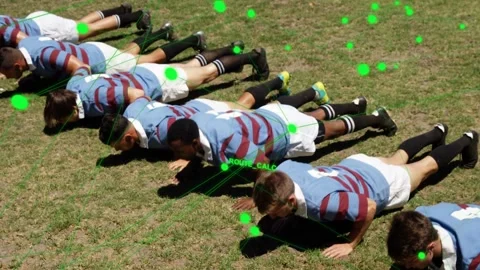 Coach cueing, team performing push-ups for training on grass, sports AR overlay Vidéo 333463609