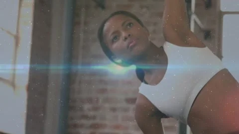 Coach doing loft stretches raising arm rotating switching for mobility lens Stock Footage 329425342