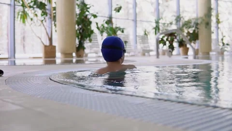 The coach explains the swimming technique to the boy Stock Footage 145757668