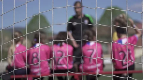 Coach giving instructions and cheering the female players in the middle part Stock Footage 238865325