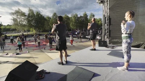 Coach Group Demonstrate Stick Squats Sport Event Stock Footage 107564771