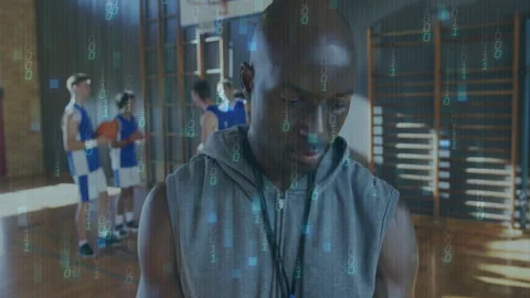 Coach in gym with binary code animation over basketball players practicing Stock Footage 305519965