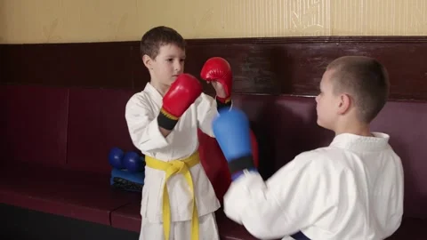 Coach helps athletes practice blocks and punches Video stock 269126253