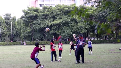 A coach with his students practicing volleyball Stock-Footage 229592380