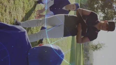 Coach instructing baseball team, data processing animation over players on field Stock Footage 312899819