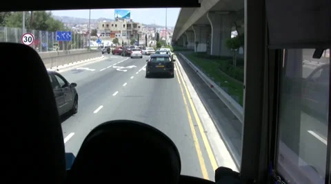 Coach joining traffic queue on a busy road in Cyprus Stock Footage 39804961