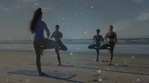 Coach leading group holding tree on beach under holo ring appearing pulsing into 스톡 동영상 333975713