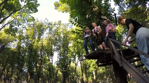 Coach mountaineer instructs a group of children climbing equipment. Video stock 59143992