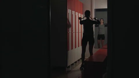 The coach prepares for training, changes clothes and puts himself in order in Stock Footage 119012450