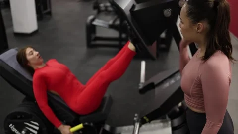 Coach pushes athlete for one more rep Stock Footage 337115008