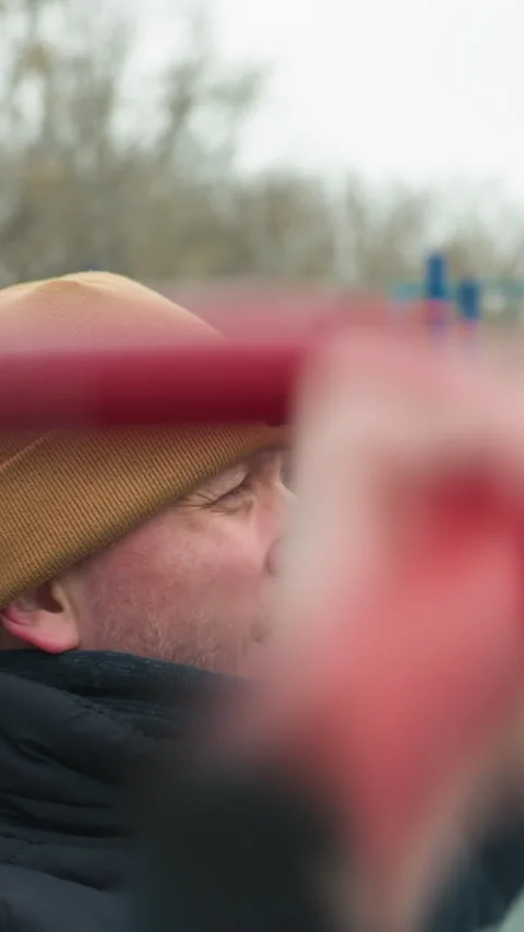Coach Resting After Pull-Ups on Outdoor Workout Equipment, Focused and Stock Footage 317576175