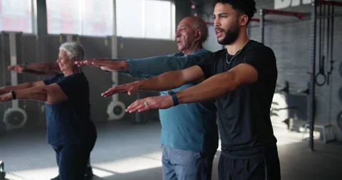 Coach, senior group and lunges for training in gym with people for muscle Stock Footage 283745231