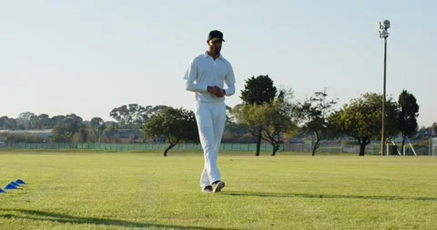 Coach signaling cone drill as player stepping cones then coach demonstrating, Stock Footage 344104240