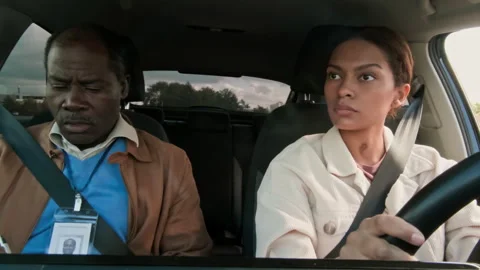 Coach Sitting in Passengers Seat during Driving Session with Learner Stock Footage 276545344