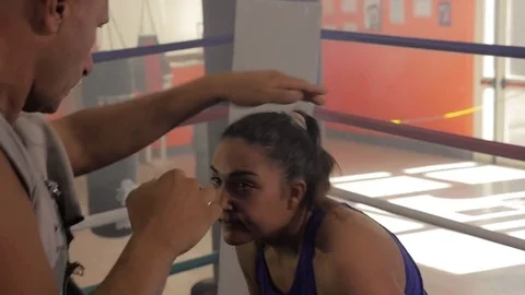 Coach training female boxer in gym Stock Footage 84938541