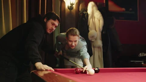 Coaching and billiards lessons for beautiful blonde young woman from man Stock Footage 329192891
