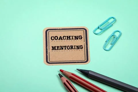 Coaching and Mentoring. Green notes and documents folder. Office supplies Stock Photos