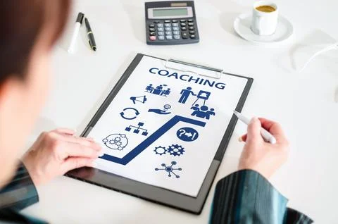 Coaching concept on a clipboard Stock Photos