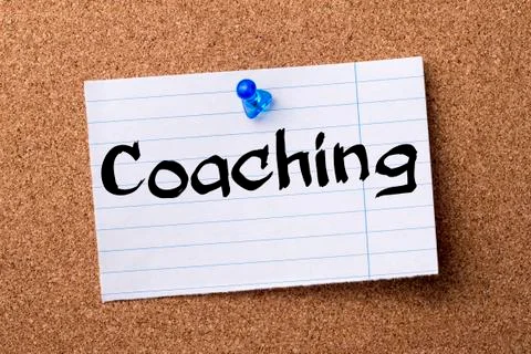 Coaching - teared note paper  pinned on bulletin board Stock Photos