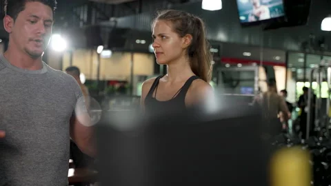 Coaching Woman Basic Workout Exercise in Fitness Gym Weight Training Stock Footage 152519573